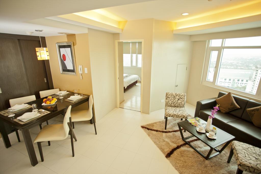 The Exchange Regency Residence Hotel Managed By Hii Pasig City Стая снимка
