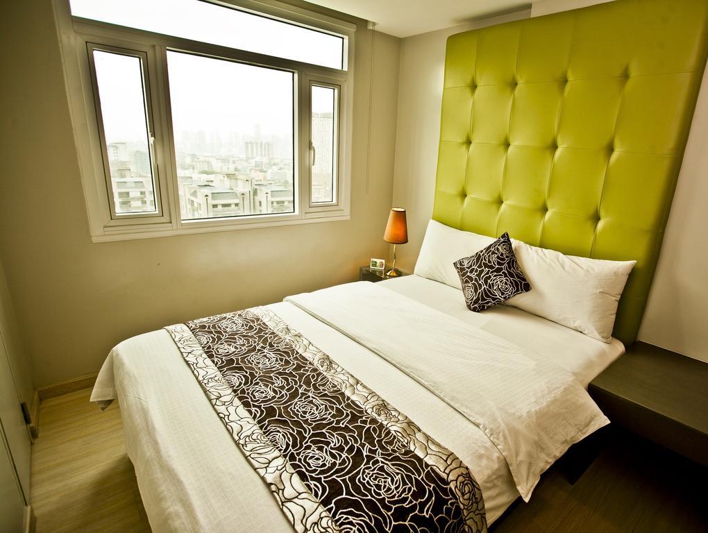 The Exchange Regency Residence Hotel Managed By Hii Pasig City Стая снимка